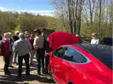 People looking at EV vehicles