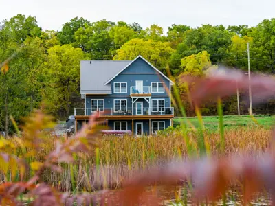 house overlooking a pond