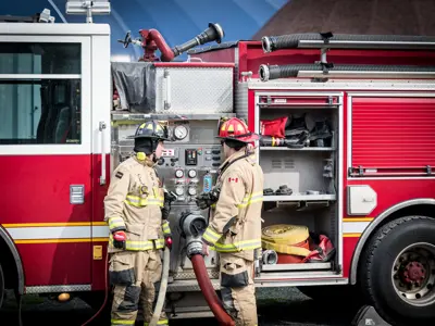 firefighters in front of a firetruck