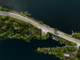 Arial shot of a road between two bodies of water