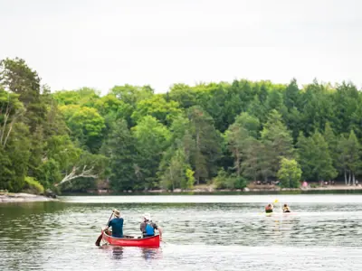 People canoeing and kayaking on a lake