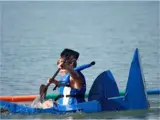kid in a cardboard boat