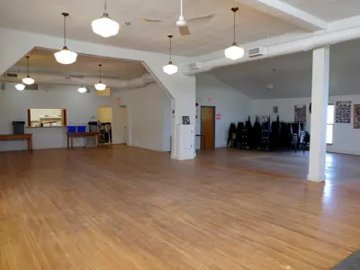 A large hall with tall ceilings and no tables or chairs set up