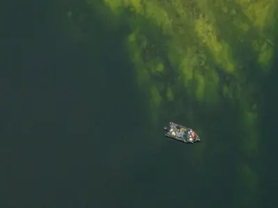 Arial shot of a boat on a lake